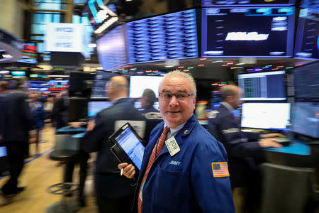 Traders work on the floor of the New York Stock Exchange (NYSE) in New York, U.S., December 18, 2018. REUTERS/Brendan McDermid