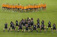 Australian players watch as the All Blacks perform a haka ahead of the Bledisloe Cup rugby test match between the All Blacks and the Wallabies at Eden Park in Auckland, New Zealand, Saturday, Sept. 24, 2022. (David Rowland/Photosport via AP)