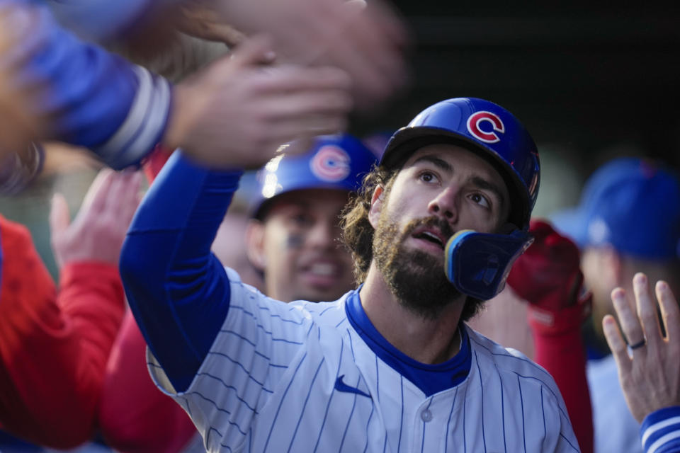 Chicago Cubs' Dansby Swanson is congratulated in the dugout after his home run during the first inning of the team's baseball game against the Houston Astros, Wednesday, April 24, 2024, in Chicago. (AP Photo/Erin Hooley)