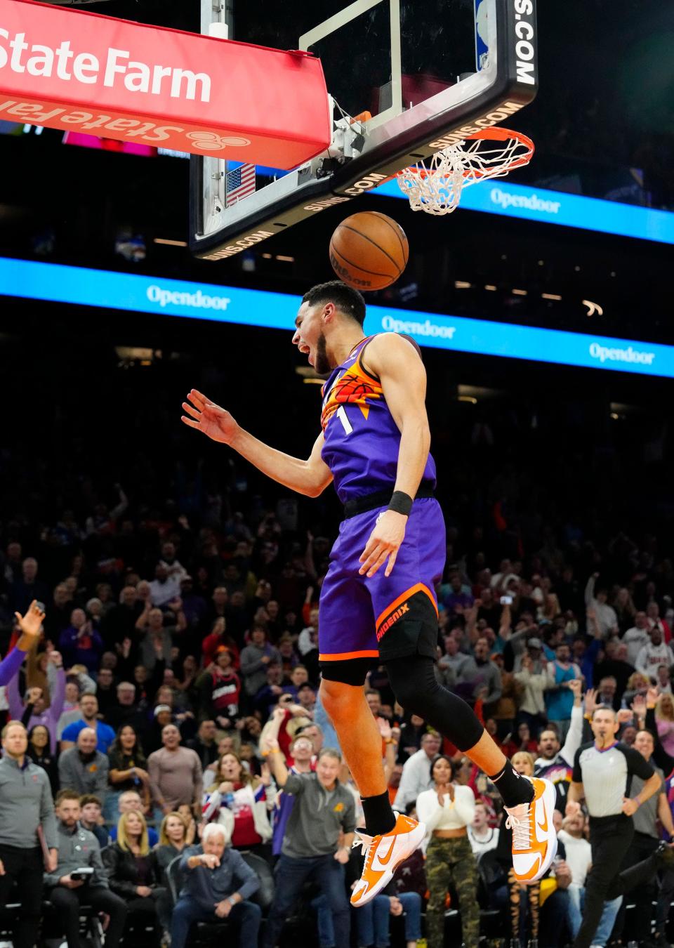 Nov 30, 2022; Phoenix, AZ, USA; Phoenix Suns guard Devin Booker (1) slam-dunks the ball against the Chicago Bulls in the second half at Footprint Center.