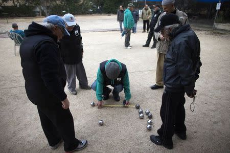 Members of the French community play boules at a club in Netanya, a city of 180,000 on the Mediterranean north of Tel Aviv, that has become the semi-official capital of the French community in Israel January 25, 2015. REUTERS/Ronen Zvulun