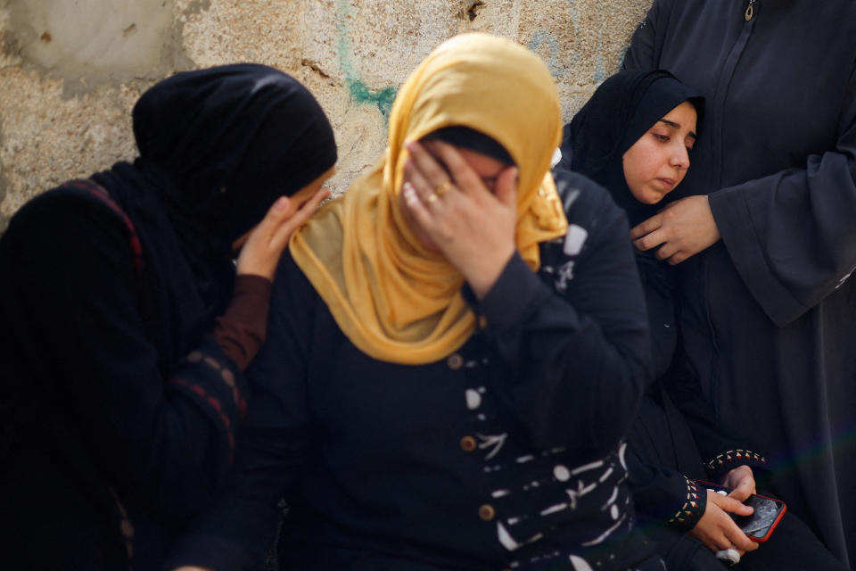 Relatives react as they attend a funeral in Gaza City on Monday. (Mohammed Salem/Reuters)