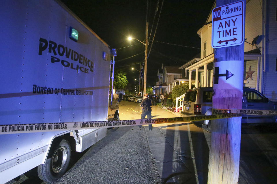 Providence Police investigate a shooting on Carolina Avenue, late Thursday, May 13, 2021, in Providence, R.I. (AP Photo/Stew Milne)