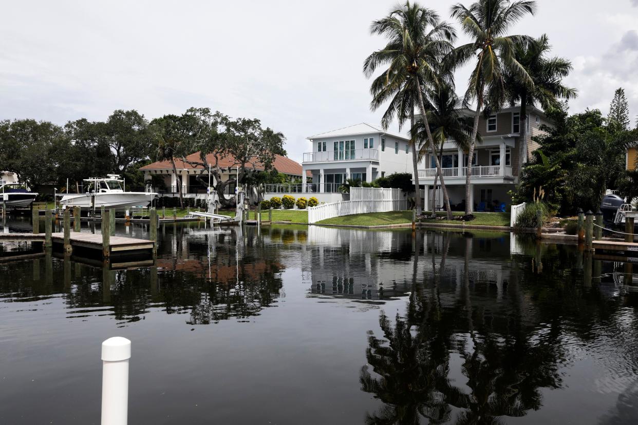 In this photo from September 2021, homes are pictured along a canal in Siesta Key near Sarasota. In the wake of Hurricane Ian, ratings of Florida insurance companies, already a source of friction, is only going to get more controversial.