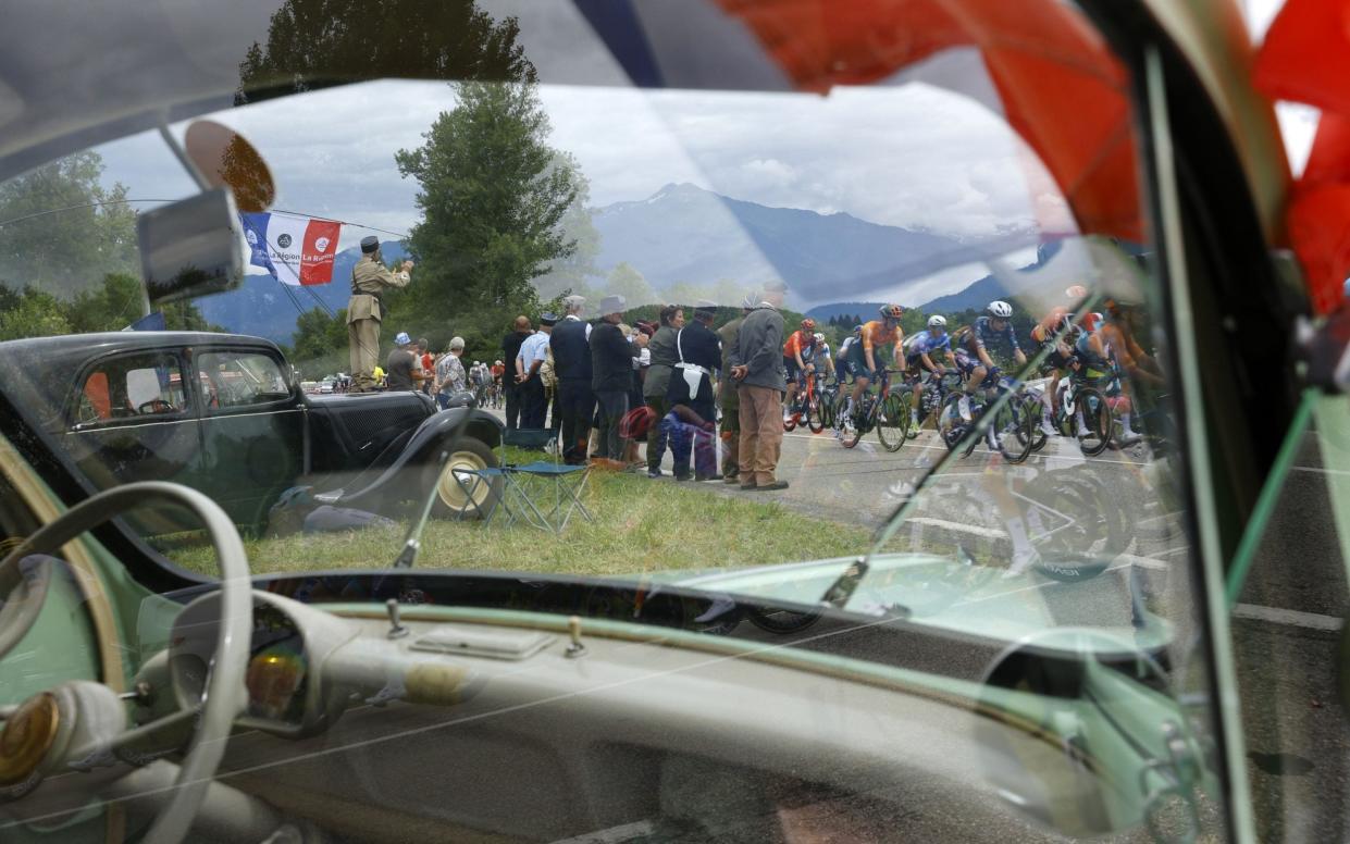 Spectators watch the peloton go past