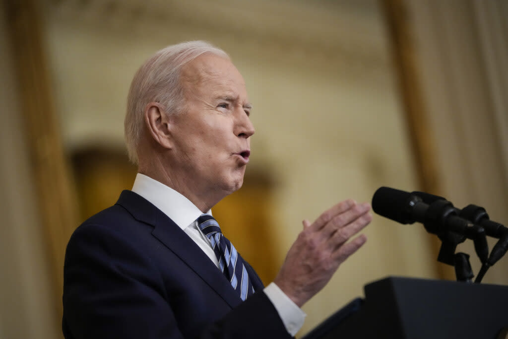 President Joe Biden speaks at a podium