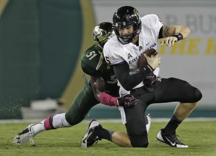 East Carolina quarterback Shane Carden (5) is sacked by South Florida linebacker Tashon Whitehurst (51) during the second quarter of an NCAA college football game Saturday, Oct. 11, 2014, in Tampa, Fla. (AP Photo/Chris O'Meara)