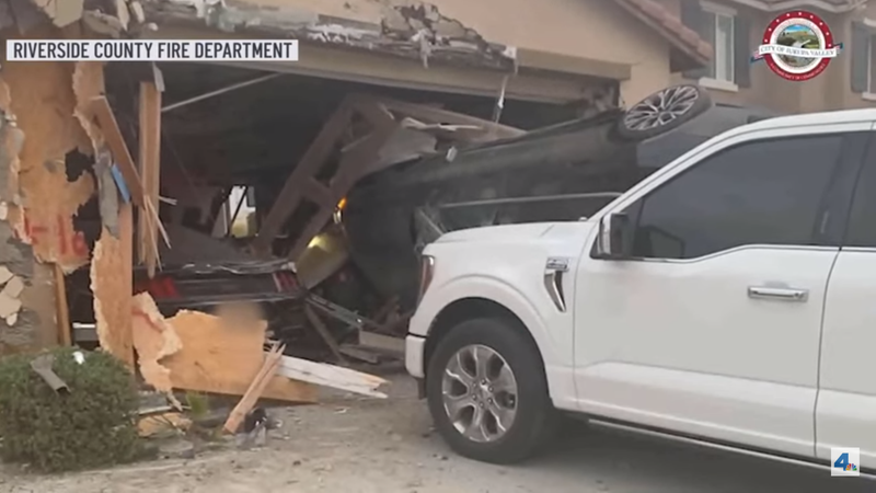 The airborne car jumped a pickup and smashed into the garage. - Screenshot: NBCLA via YouTube