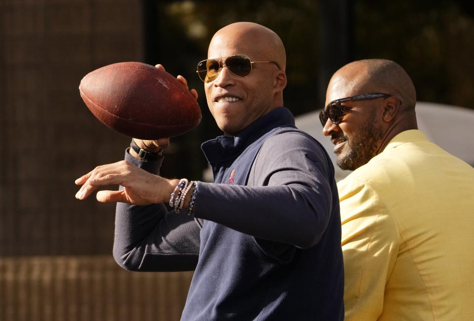 Grand Marshal Richard Jefferson plays catch during the 51st edition of the Vrbo Fiesta Bowl Parade in Phoenix on Dec. 16, 2023.