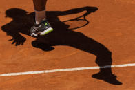 Daniel Evans of Britain serves during a match against Andrey Rublev of Russia at the Mutua Madrid Open tennis tournament in Madrid, Thursday, May 5, 2022. (AP Photo/Bernat Armangue)