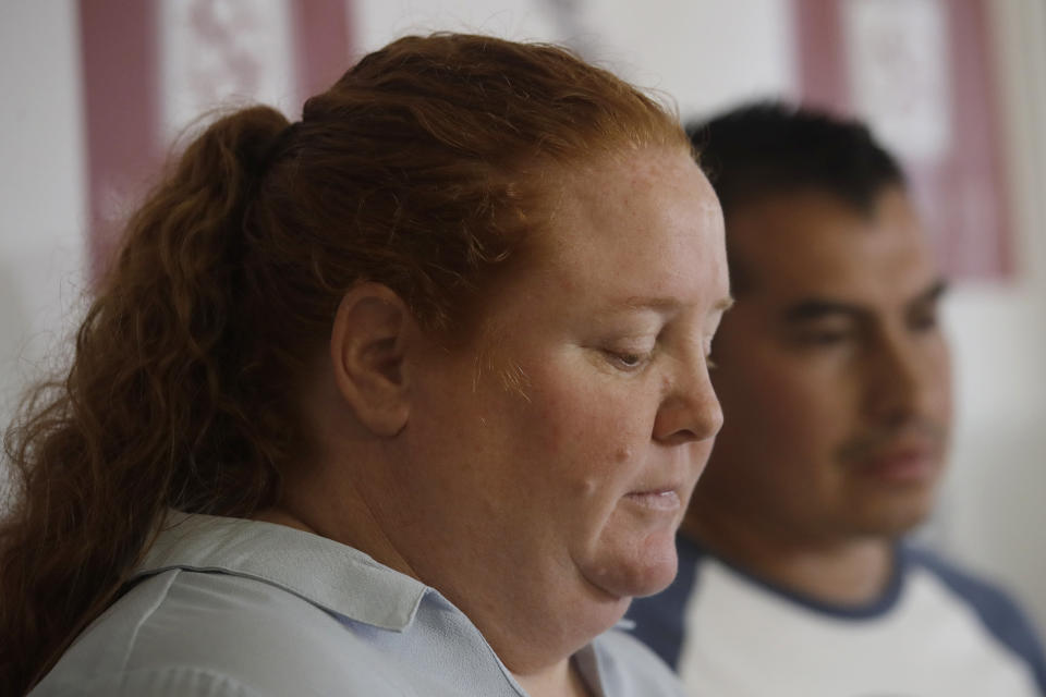 Wendy Towner, left, speaks next to Francisco Aguilera at a news conference in San Francisco, Tuesday, Nov. 12, 2019. Towner and Aguilera are two of the plaintiffs in a lawsuit that alleges that negligent security measures allowed a gunman to sneak in and fatally shoot three people and wound 13 others at a popular Northern California food festival last summer. (AP Photo/Jeff Chiu)