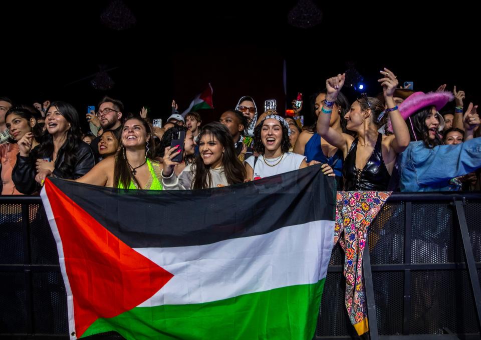 Festivalgoers cheer as Saint Levant performs at the Gobi tent during the Coachella Valley Music and Arts Festival in Indio, Calif., Saturday, April 13, 2024.