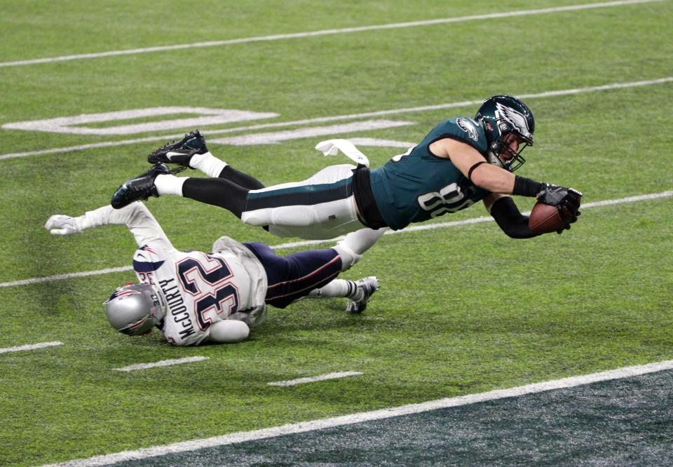 Feb 4, 2018: Philadelphia Eagles tight end Zach Ertz (86) scores a touchdown over defender New England Patriots free safety Devin McCourty (32) during the fourth quarter in Super Bowl LII at U.S. Bank Stadium.