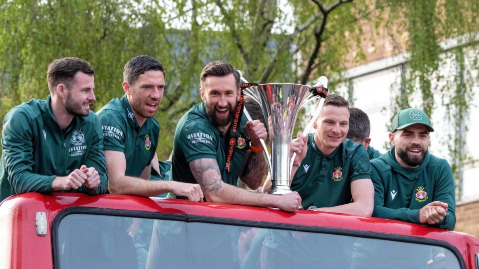 Wrexham players including Ollie Palmer and Paul Mullin celebrate during the team's Victory Parade on May 2, 2023