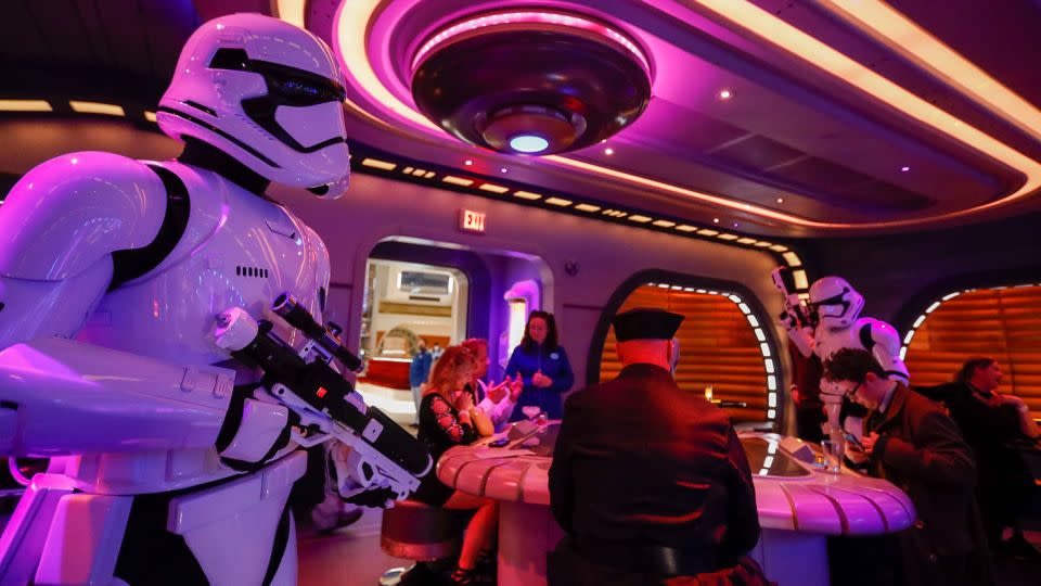 A stormtrooper walks through the crowd at Star Wars: Galactic Cruiser. - Allen J. Schaben/Los Angeles Times/Getty Images