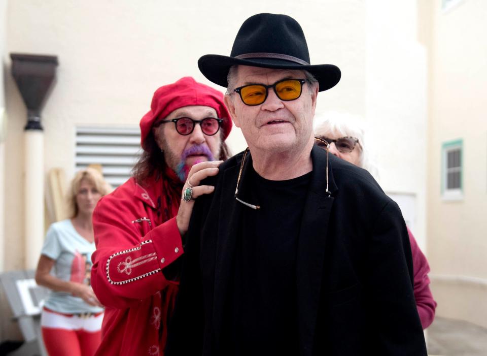 American record producer Mark Hudson and Micky Dolenz meet before the celebrity symposium during the Beatles On The Beach Festival in Delray Beach December 17, 2022. 