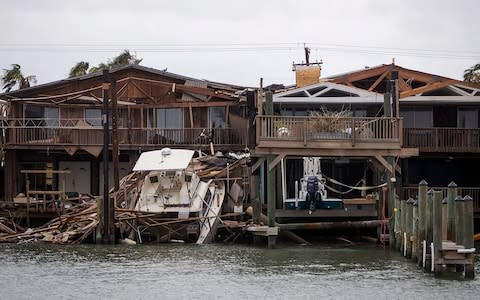 A boat sits on a dock after Hurricane Harvey passed through Port Aransas, Texas - Credit:  Nick Wagner