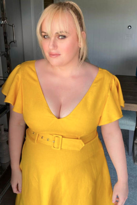 Rebel Wilson in a fitted yellow dress