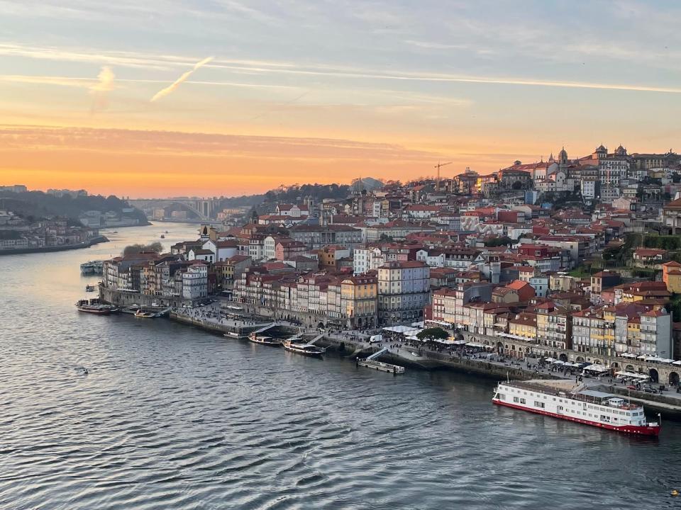 A European city on the water at sunset.