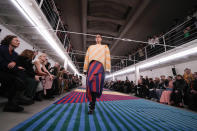 A model wears a creation as part of the Sunnei women's Fall-Winter 2024-25 collection presented in Milan, northern Italy, Friday, Feb. 23, 2024. (AP Photo/Luca Bruno)