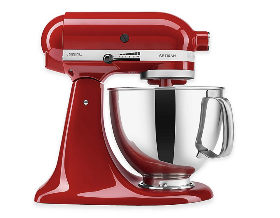 KitchenAid Artisan Stand Mixer in red with stainless steel bowl and attachments