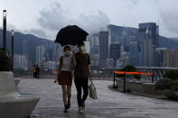 A couple walk along the waterfront of the Victoria Harbor of Hong Kong Tuesday, May 26, 2020. Hong Kong has been living on borrowed time ever since the British made it a colony nearly 180 years ago, and all the more so after Beijing took control in 1997, granting it autonomous status. A national security law approved by China's legislature Thursday is a reminder that the city's special status is in the hands of Communist Party leaders who have spent decades building their own trade and financial centers to take Hong Kong's place. (AP Photo/Kin Cheung)