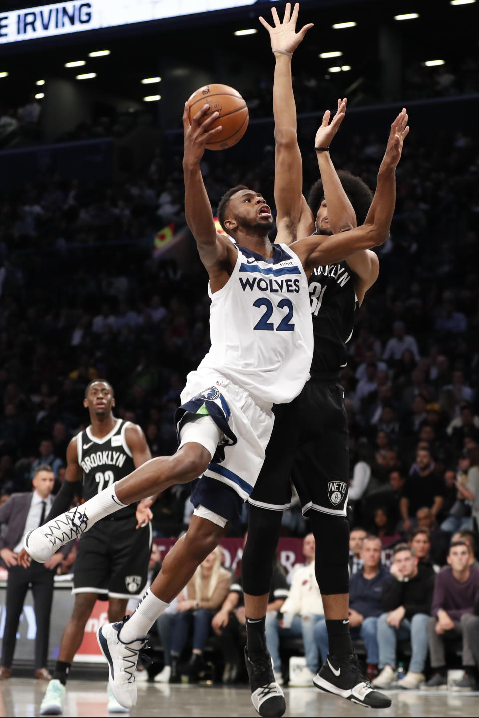 Brooklyn Nets center Jarrett Allen (31) defends against Minnesota Timberwolves forward Andrew Wiggins (22) during the first half of an NBA basketball game Wednesday, Oct. 23, 2019, in New York. (AP Photo/Kathy Willens)