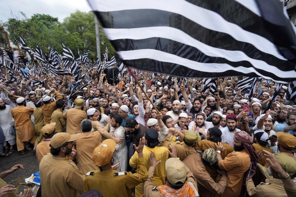 Supporters of a religious group 'Jamiat Ulema-e-Islam-F party chant slogans during a rally to denounce the burning of Islam's holy book 'Quran,' in Sweden in Karachi, Pakistan, Sunday, July 23, 2023. (AP Photo/Fareed Khan)