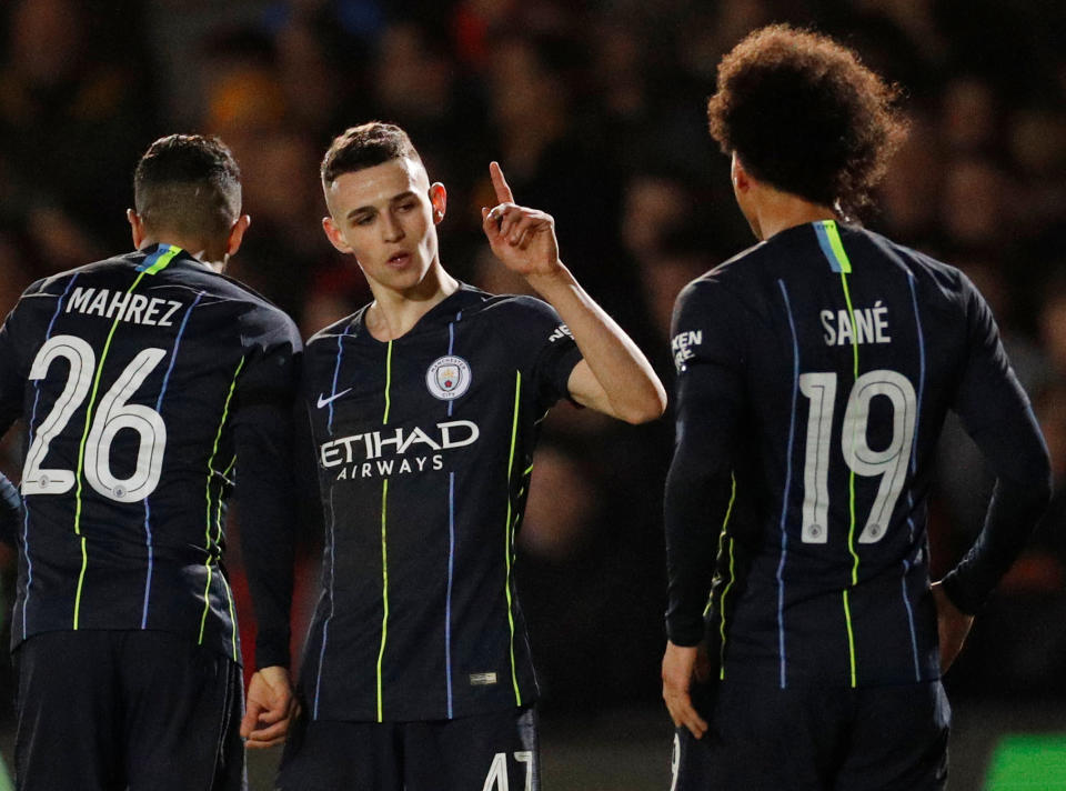 Riyad Mahrez, Phil Foden (center) and Leroy Sane provided the goals as Manchester City breezed to FA Cup victory. (Reuters)