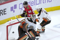 Chicago Blackhawks' Patrick Kane (88) watches his shot fly past Anaheim Ducks' Anthony Stolarz (41) as Cam Fowler also defends during the third period of an NHL hockey game Tuesday, Feb. 7, 2023, in Chicago. The Ducks won in overtime 3-2. (AP Photo/Charles Rex Arbogast)