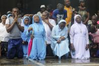 Catholic faithful pray during a procession re-enacting the death of Jesus Christ, on Good Friday in Lagos April 18, 2014.