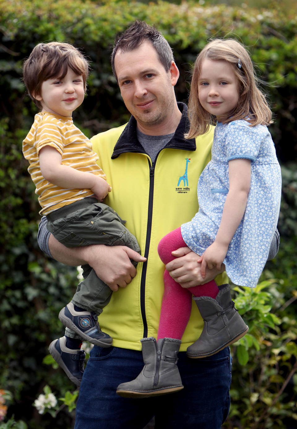 Dad-of-two Sam Mills, 38, pictured here with his own children Molly and Harry, spent years working as a luxury furniture designer producing high-end pieces for celebrities. [Photo: Caters]