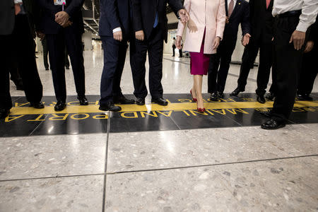 Carrie Lam, Hong Kong's chief executive, steps over the border line into China during a tour at West Kowloon Station, which houses the terminal for the Guangzhou-Shenzhen-Hong Kong Express Rail Link (XRL), developed by MTR Corp., in Hong Kong, China, September 22, 2018. Giulia Marchi/Pool via REUTERS