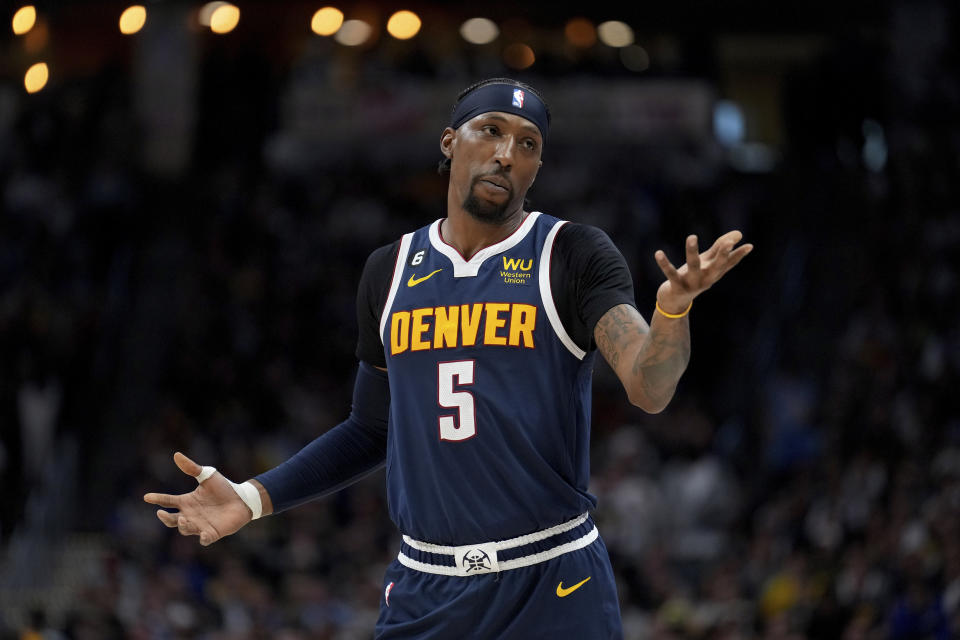 Denver Nuggets guard Kentavious Caldwell-Pope (5) looks towards his bench during the first half of Game 2 of the NBA basketball Western Conference Finals series against the Los Angeles Lakers, Thursday, May 18, 2023, in Denver. (AP Photo/Jack Dempsey)