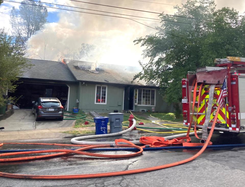 Firefighters battle a house fire on Willis Street on Wednesday, Sept. 27, 2023.