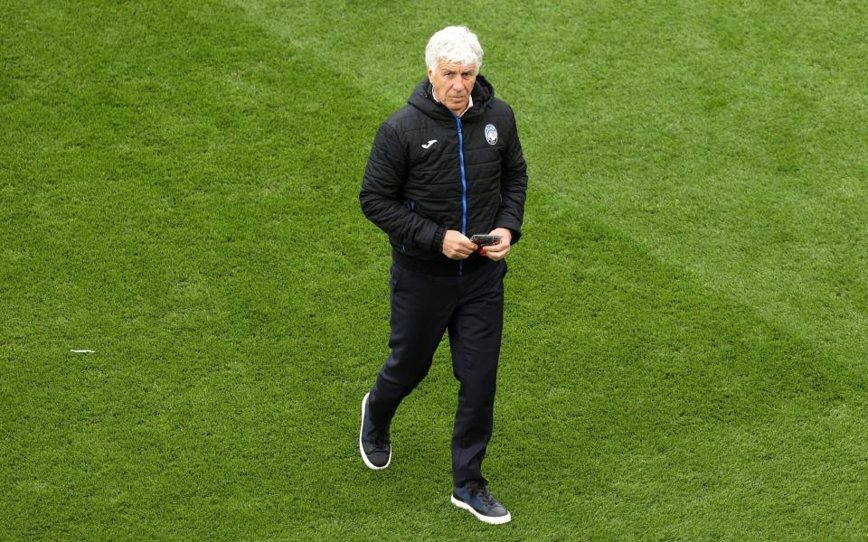 Atalanta manager Gian Piero Gasperini inspects the pitch before the UEFA Europa League final