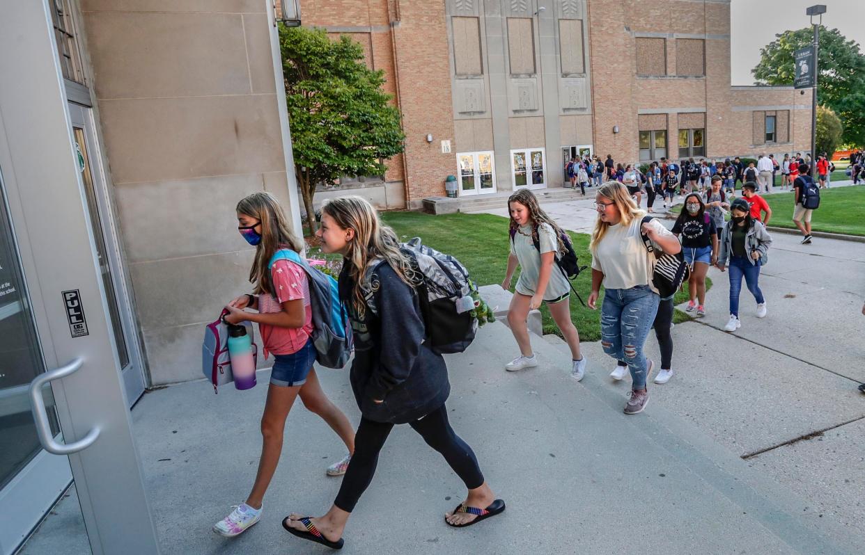 Students enter Urban Middle School to begin the new school year, Wednesday, September 1, 2021, in Sheboygan, Wis.