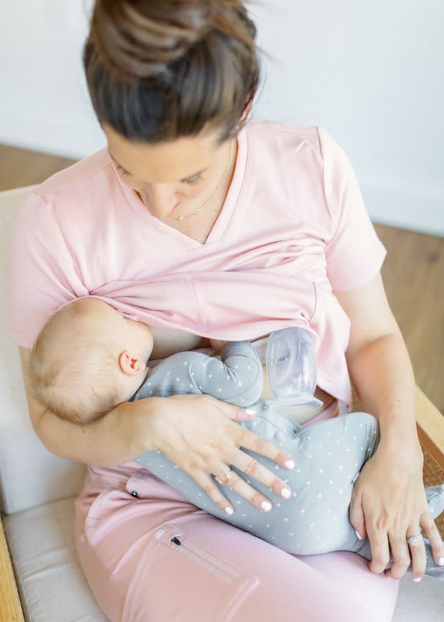 Karrie Locher — a registered nurse, certified lactation counselor and mother of four — nurses her son. (Photo: Diggnity Photography)