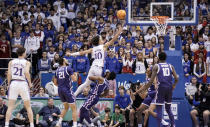 Kansas forward Jalen Wilson (10) gets inside for a bucket against TCU during the second half of an NCAA college basketball game on Saturday, Jan. 21, 2023, at Allen Fieldhouse in Lawrence, Kan. TCU defeated Kansas, 83-60. (AP Photo/Nick Krug)