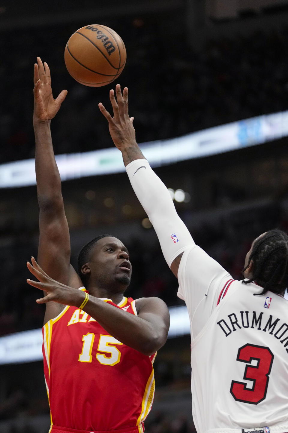 Chicago Bulls center Andre Drummond, right, blocks the shot of Atlanta Hawks center Clint Capela during the first half of an NBA basketball game Tuesday, Dec. 26, 2023, in Chicago. (AP Photo/Erin Hooley)