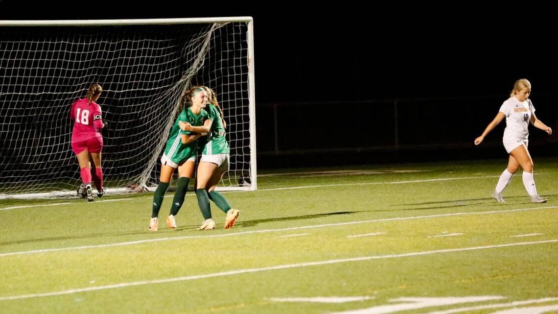 Frederick Douglass’s Ellie Majors, right, hugs teammate Ella Flynn after Flynn’s go-ahead goal in the Broncos’ 2-1 win over defending state champion Bethlehem.