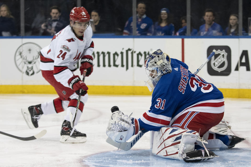 New York Rangers goaltender Igor Shesterkin (31) makes a save against Carolina Hurricanes center Seth Jarvis (24) during the first period of an NHL hockey game Tuesday, March 21, 2023, at Madison Square Garden in New York. (AP Photo/Mary Altaffer)
