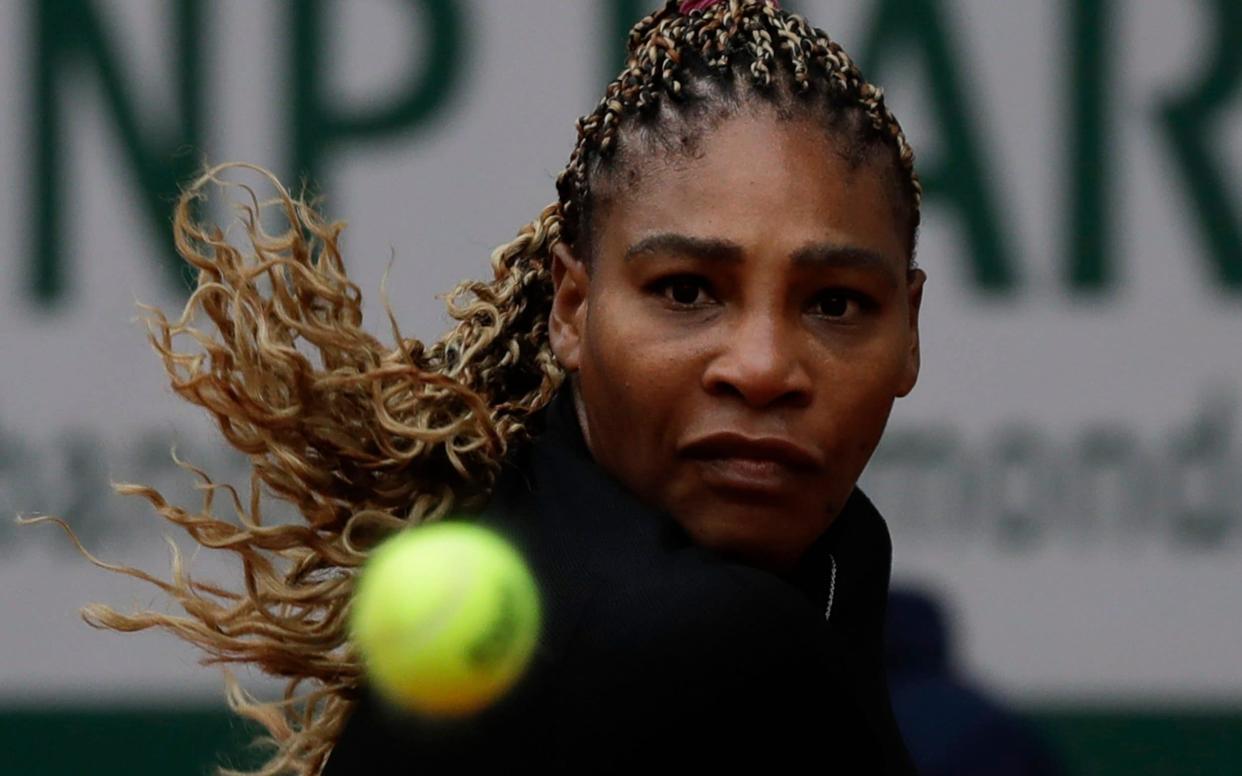 Serena Williams of the U.S. eyes the ball as she plays a shot against Kristie Ahn of the U.S. in the first round match of the French Open tennis tournament at the Roland Garros stadium in Paris - AP Photo/Alessandra Tarantino