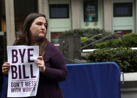 A protestor from the National Organization for Women of New York (NOW-NYC) holds a protest in front of Fox News Channel and the News Corporation Headquarters, following the firing of Bill O'Reilly, in New York City, U.S. April 20, 2017. REUTERS/Shannon Stapleton