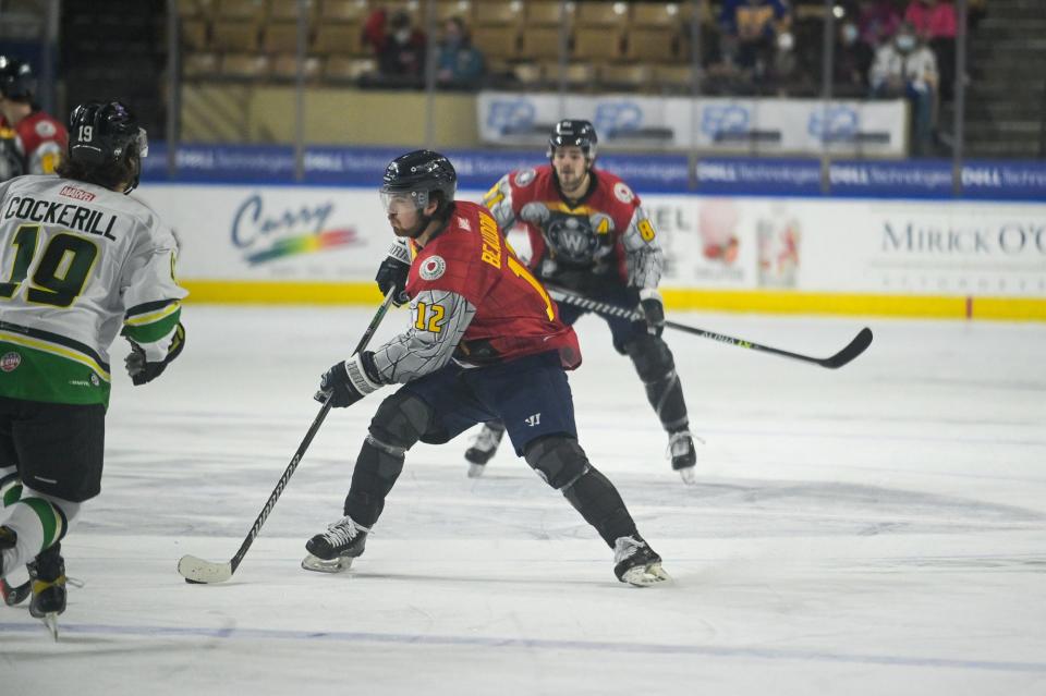 The Railers' Brent Beaudoin (12), in a uniform commemorating Marvel Super Heroes, carries the puck before scoring Saturday night.