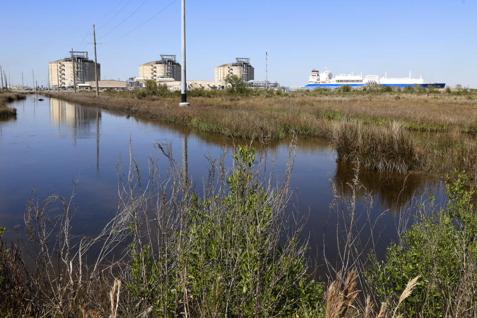 A French ship, known as the LNG Endeavor, docks next to the Cameron LNG export facility near Hackberry, La., on Thursday, March 31, 2022. The ship was filling up with LNG, or liquified natural gas. Natural gas is cooled at the facility and converted to liquid so that bigger quantities can be shipped. It's then converted back to gas when it arrives in Asia, Europe or other destinations. Companies and investors have poured $63 billion into building U.S. LNG export terminals over the past decade and could spend more than $100 billion over the next 20 years, according to an analysis by Rystad Energy. (AP Photo/Martha Irvine)