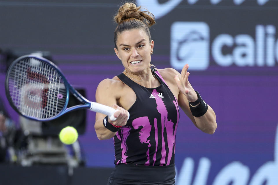 Maria Sakkari, of Greece, returns to Jessica Pegula, of the United States, during the WTA tennis tournament final match in Guadalajara, Mexico, Sunday, Oct. 23, 2022. (AP Photo/Refugio Ruiz)