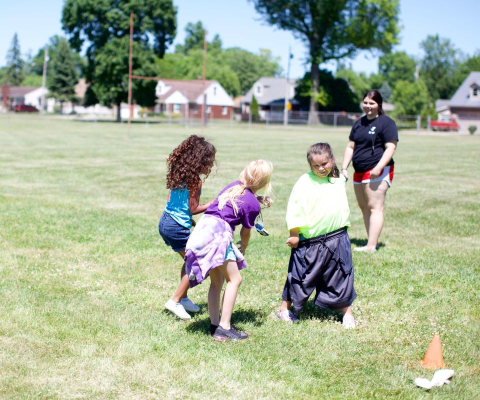 Practicing teamwork, younger students had fun doing a relay race at Y Camp to cap off a long day after summer school.