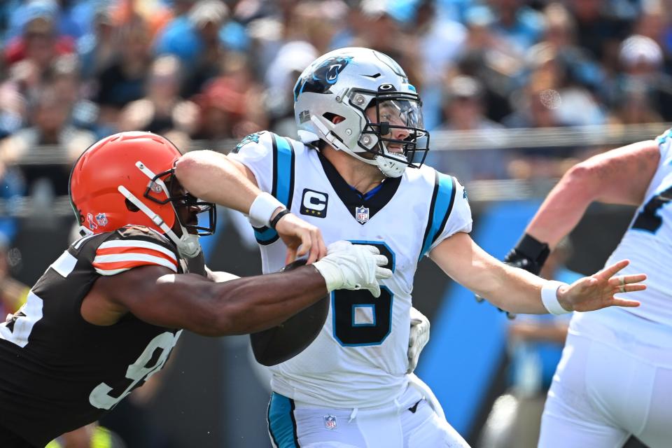 Cleveland Browns defensive end Myles Garrett strips the ball from Carolina Panthers quarterback Baker Mayfield.