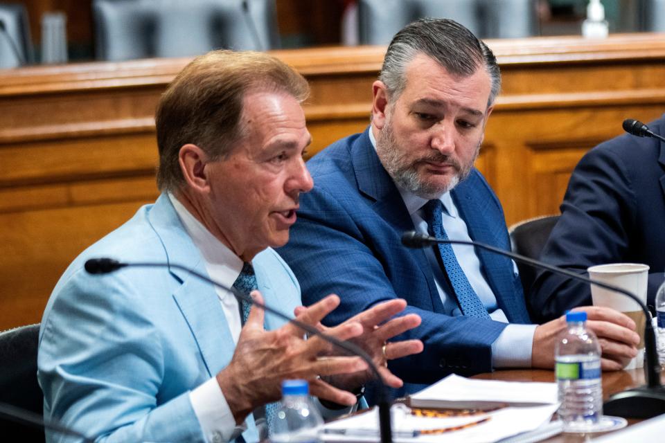 Former University of Alabama Head Football Coach Nick Saban, from left, speaks as Sen. Ted Cruz, R-Texas, listens during a roundtable on the future of college athletics and the need to codify name, image and likeness rights for student athletes, on Capitol Hill, Tuesday, March 12, 2024, in Washington. (AP Photo/Manuel Balce Ceneta) ORG XMIT: DCMC107